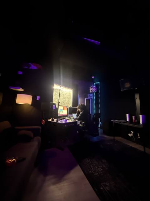 Studio lit by screens and colored light
